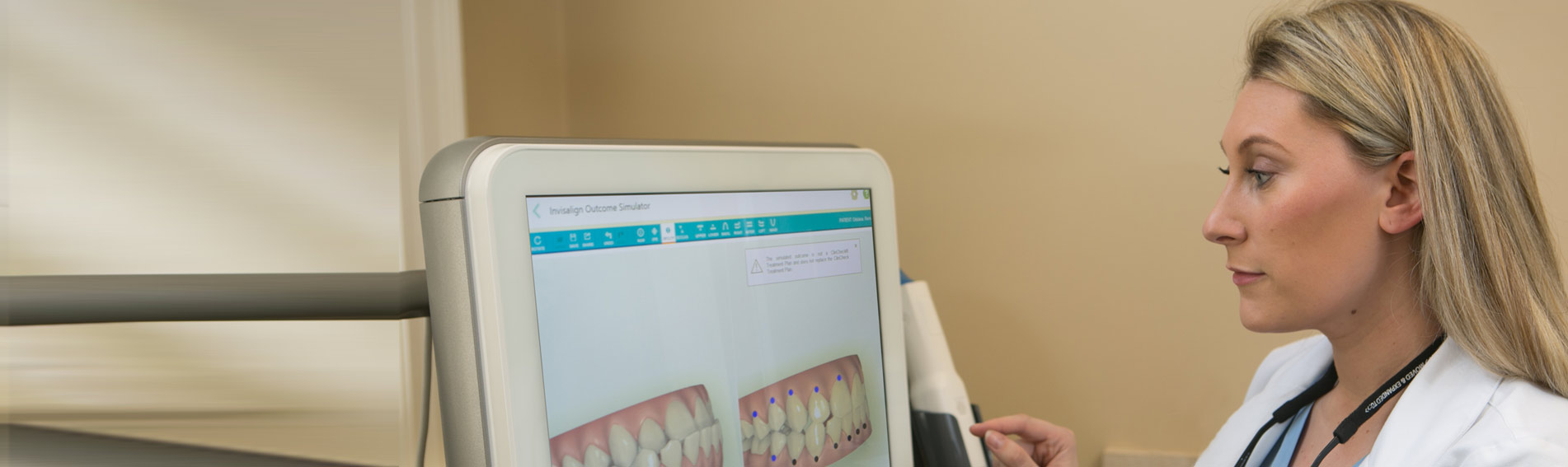 A Princeton Center clinician reviewing a digital treatment plan on a chairside screen